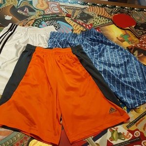 3 pair of athletic shorts, all 3 have pockets.